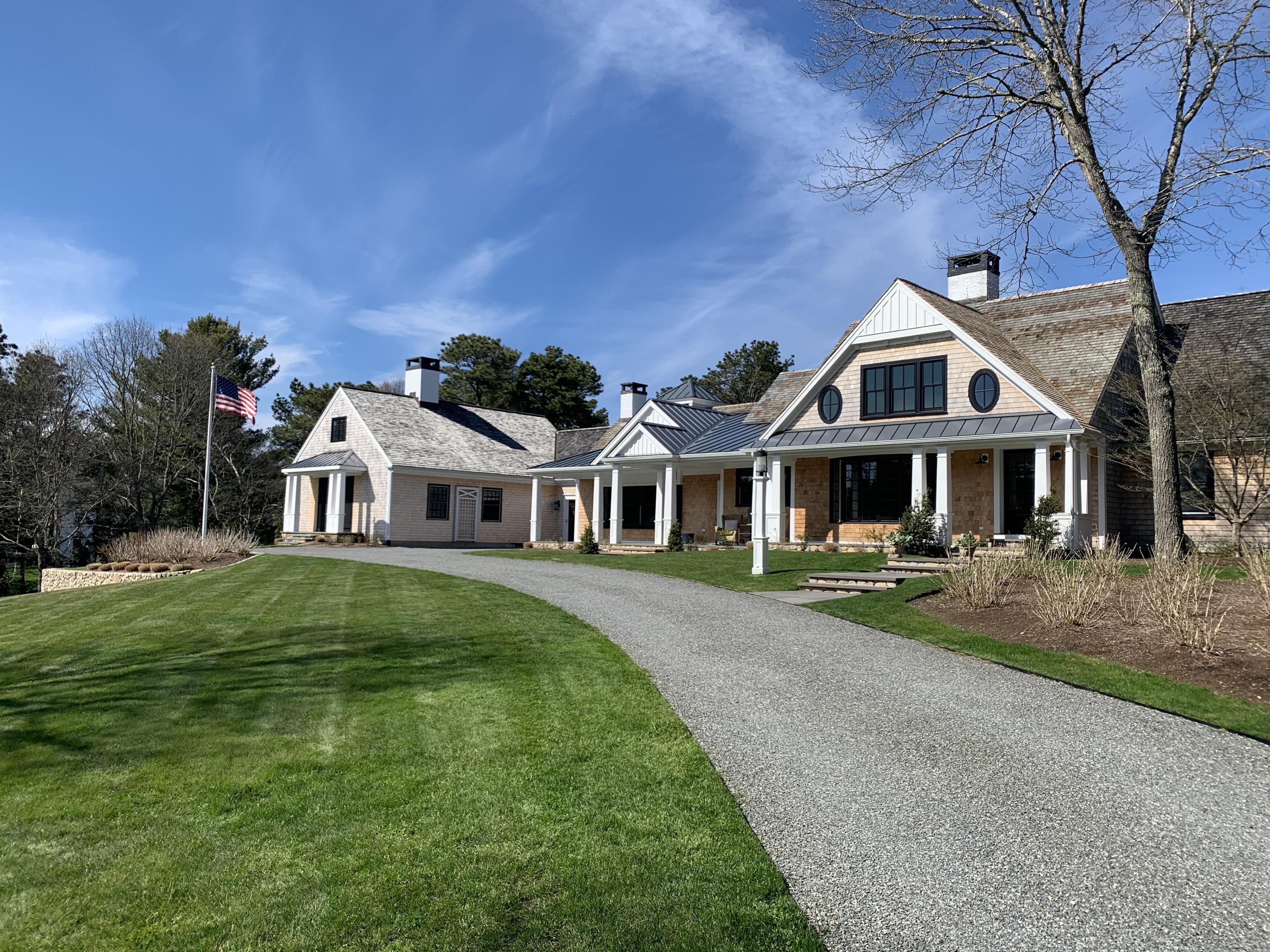 120 Smoke Valley Road Osterville, MA 02655 - Photo 57 of 64 a front view of a house with garden