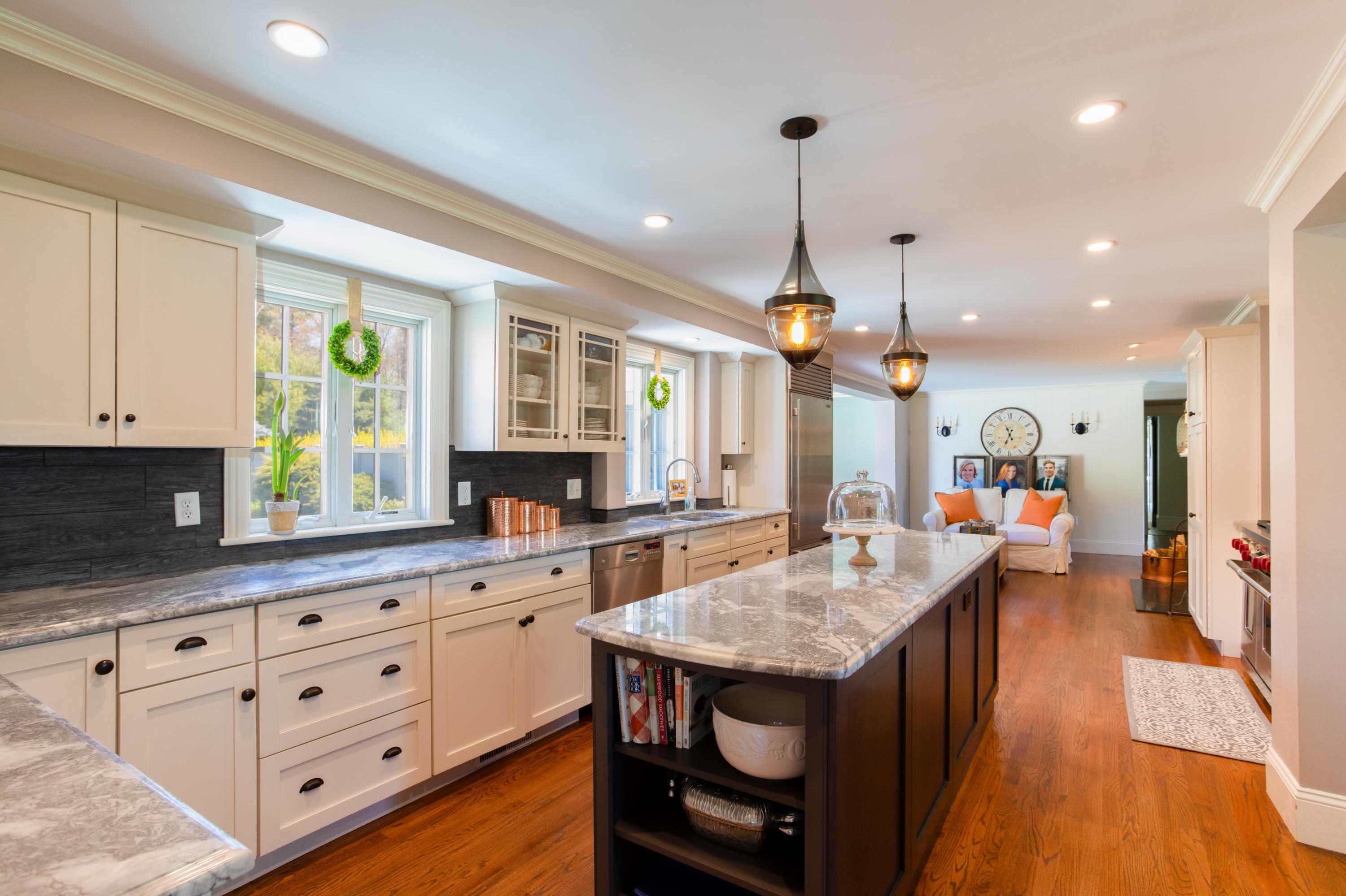 120 Smoke Valley Road Osterville, MA 02655 - Photo 6 of 64 a kitchen with granite countertop a stove a oven a dining table and chairs with wooden floor