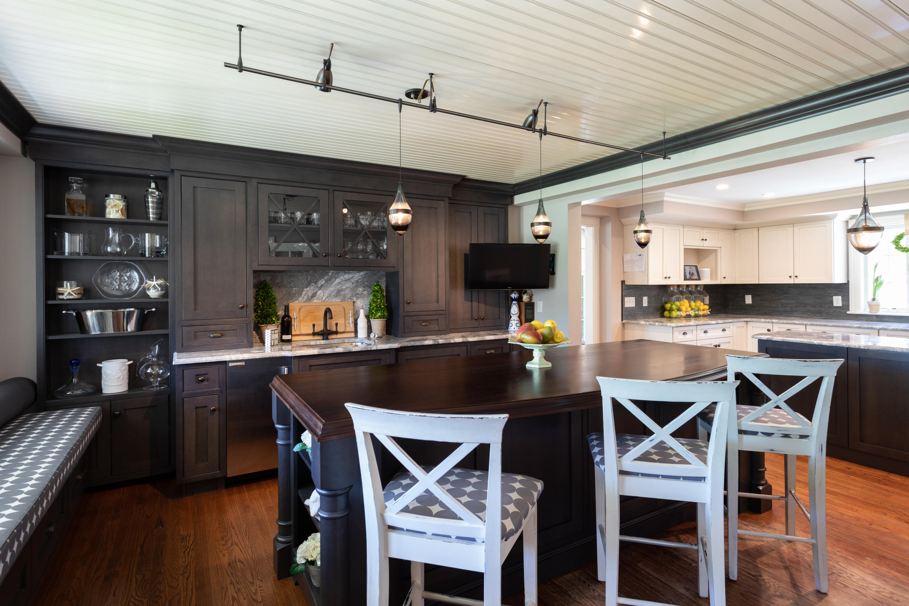 120 Smoke Valley Road Osterville, MA 02655 - Photo 9 of 64 a kitchen with a dining table chairs and cabinets