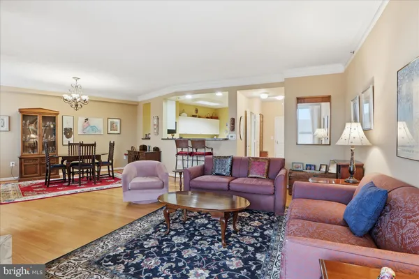 a living room with furniture fireplace and a table