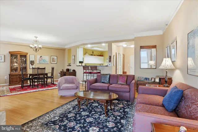 a living room with furniture fireplace and a table
