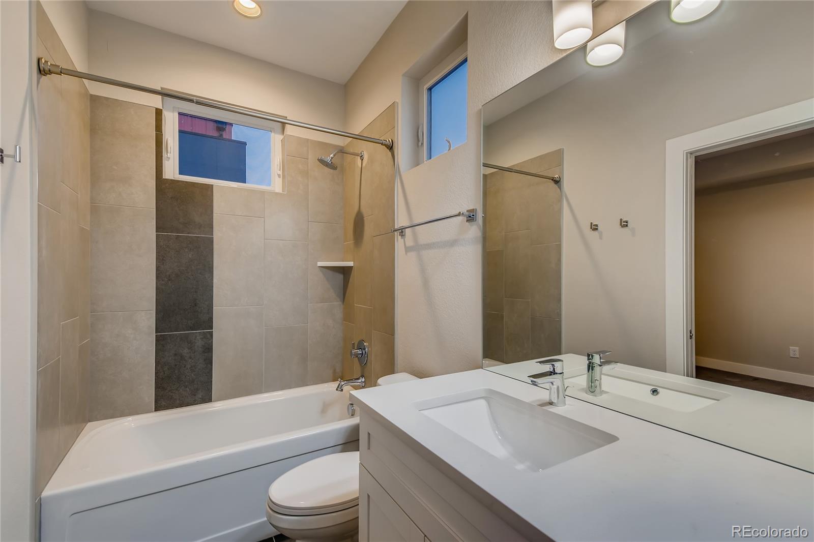 927 Inca Street, Unit 7 Denver, CO 80204 - Photo 29 of 38 a bathroom with a sink toilet and shower