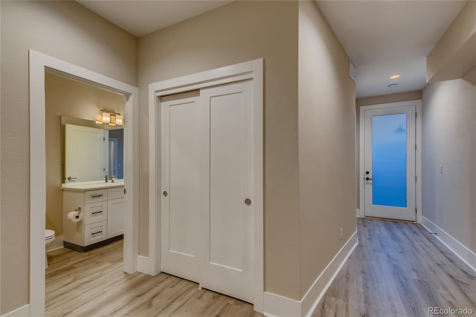 927 Inca Street, Unit 7 Denver, CO 80204 - Photo 3 of 38 a view of a bathroom with wooden floor
