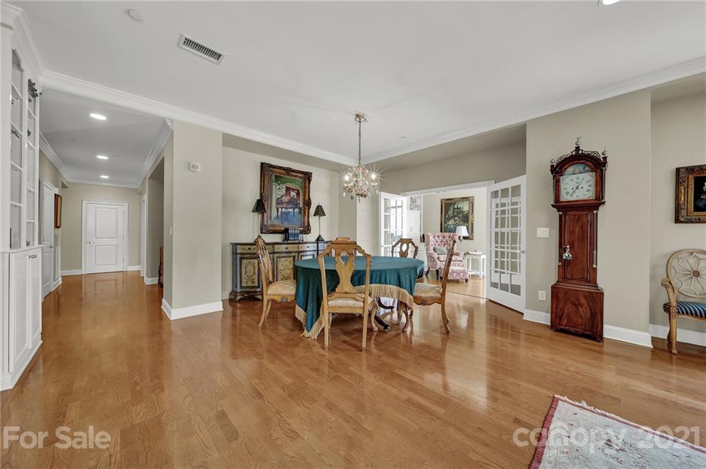 435 South Tryon Street, Unit 706 Charlotte, NC 28202 - Photo 17 of 40 a living room with furniture and a chandelier