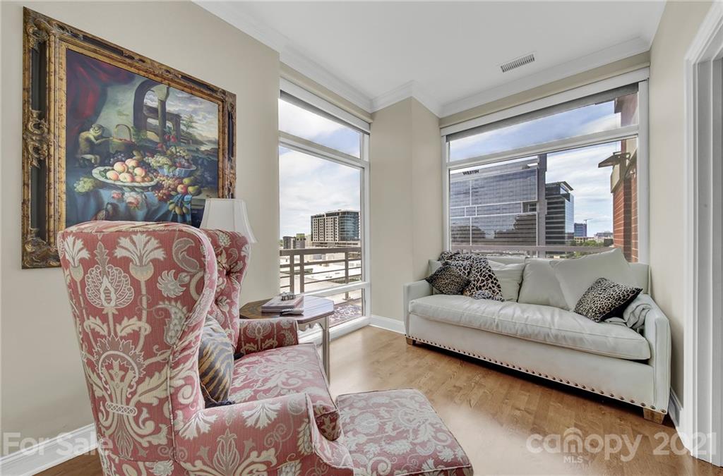 435 South Tryon Street, Unit 706 Charlotte, NC 28202 - Photo 20 of 40 a living room with furniture and a large window