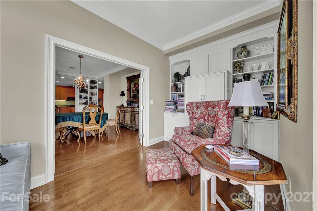 435 South Tryon Street, Unit 706 Charlotte, NC 28202 - Photo 21 of 40 a living room with furniture and wooden floor