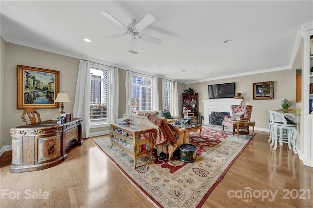 435 South Tryon Street, Unit 706 Charlotte, NC 28202 - Photo 22 of 40 a living room with fireplace furniture and a window