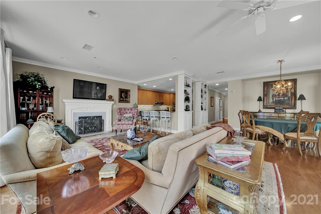 435 South Tryon Street, Unit 706 Charlotte, NC 28202 - Photo 26 of 40 a living room with fireplace furniture and a flat screen tv