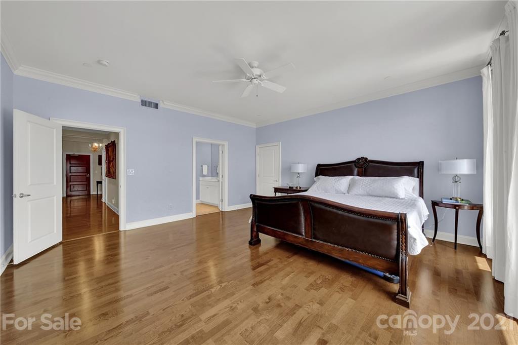 435 South Tryon Street, Unit 706 Charlotte, NC 28202 - Photo 28 of 40 a bedroom with a bed and a table in it