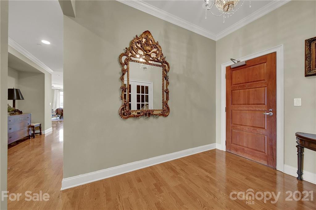 435 South Tryon Street, Unit 706 Charlotte, NC 28202 - Photo 8 of 40 wooden floor in an empty room with a window