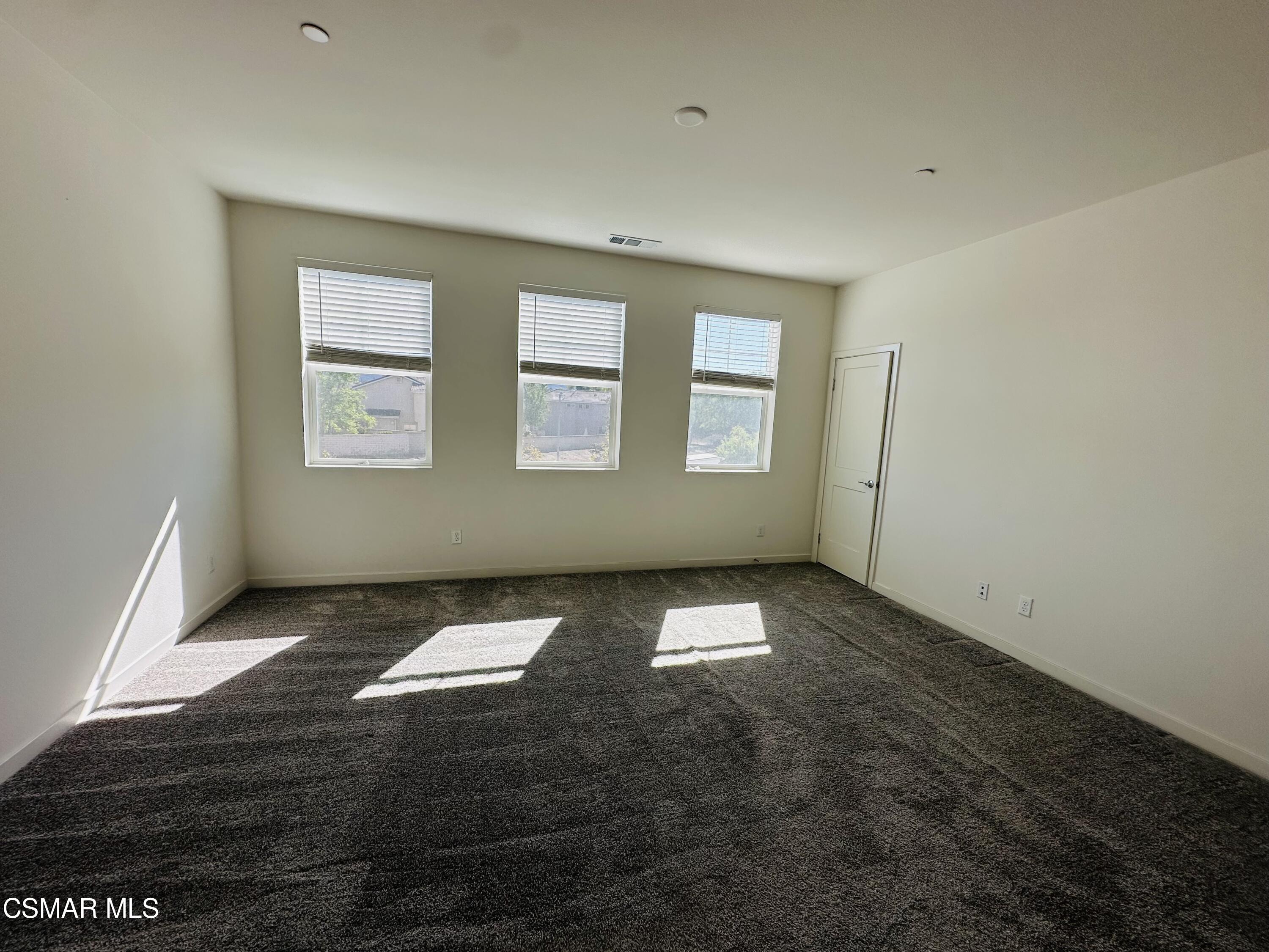 300 Farmhouse Drive, Unit 4 Simi Valley, CA 93065 - Photo 13 of 22 an empty room with windows