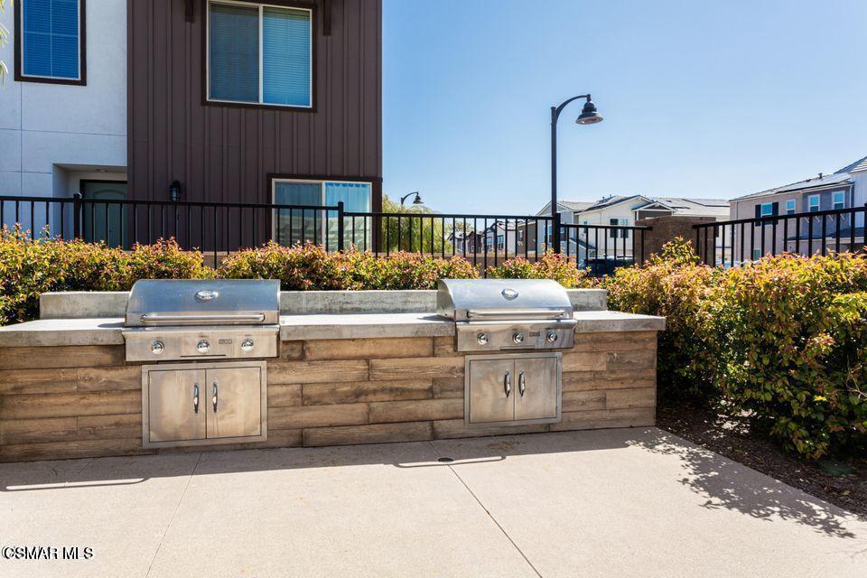 300 Farmhouse Drive, Unit 4 Simi Valley, CA 93065 - Photo 18 of 22 a view of a chairs and tables in the patio