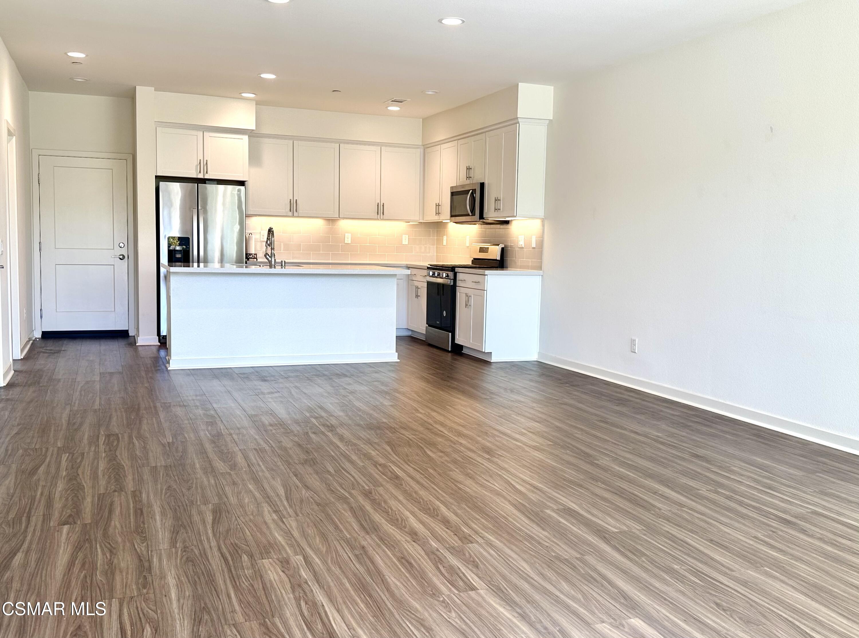 300 Farmhouse Drive, Unit 4 Simi Valley, CA 93065 - Photo 6 of 22 a view of kitchen with wooden floor