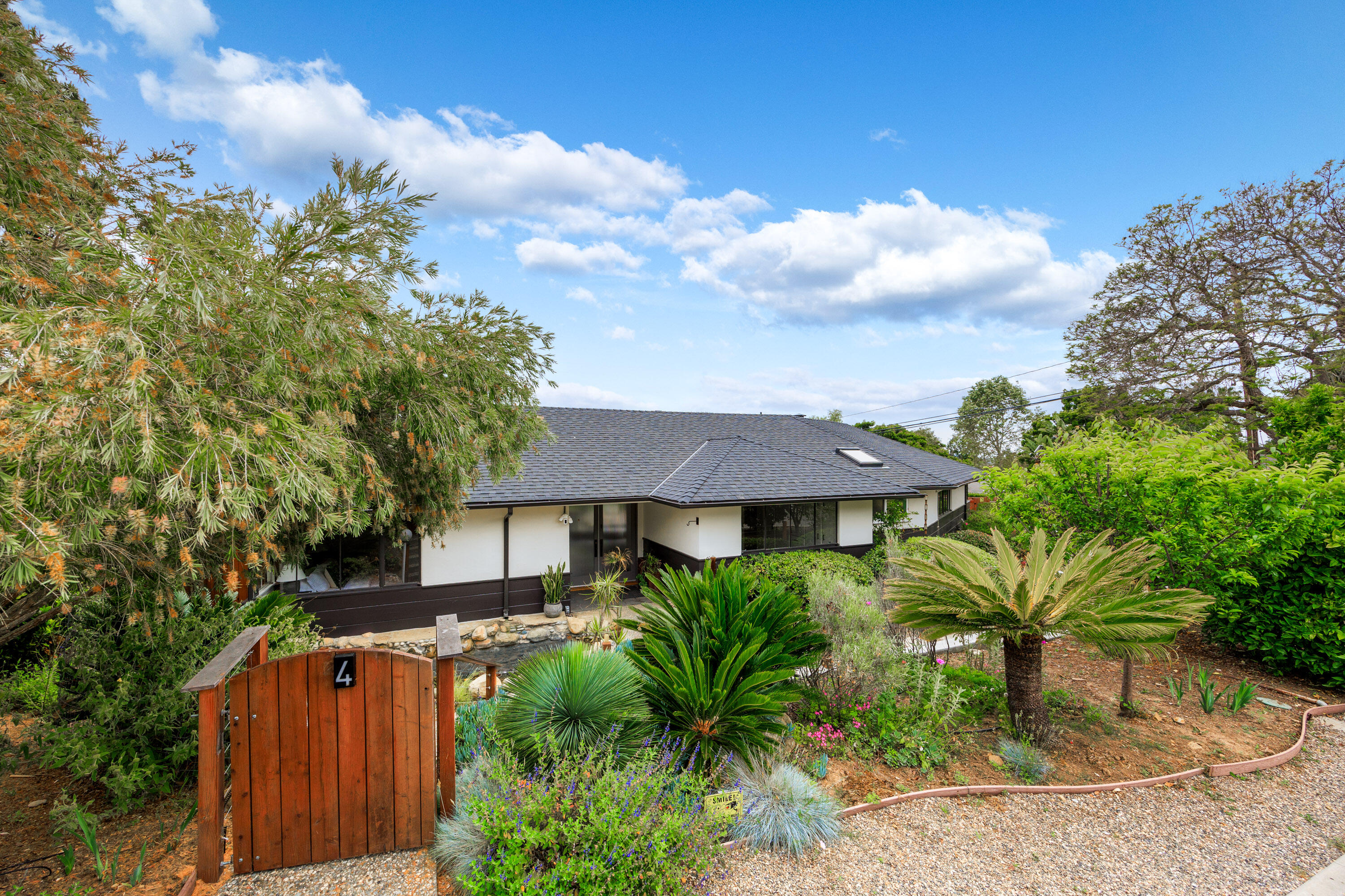 4 El Arco Drive Santa Barbara, CA 93105 - Photo 1 of 26 a front view of a house with a yard