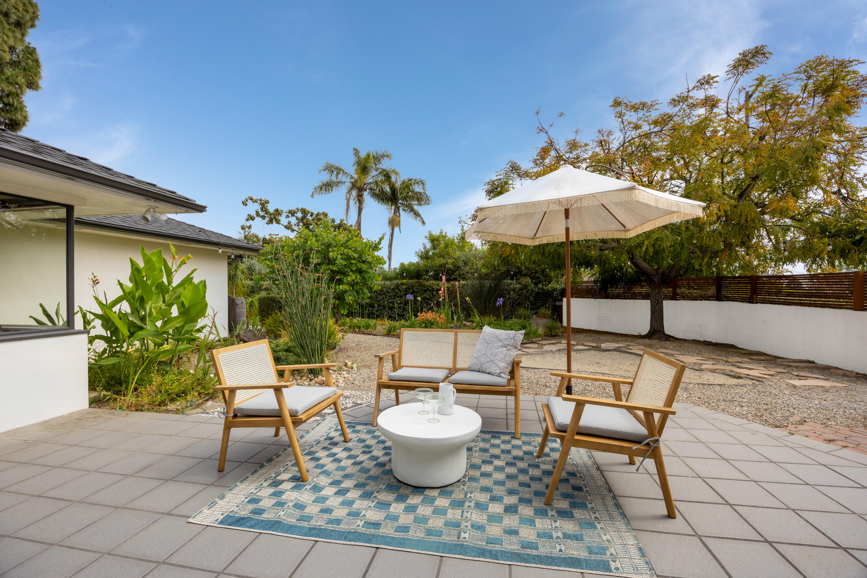 4 El Arco Drive Santa Barbara, CA 93105 - Photo 16 of 26 a view of a patio with chairs and potted plants