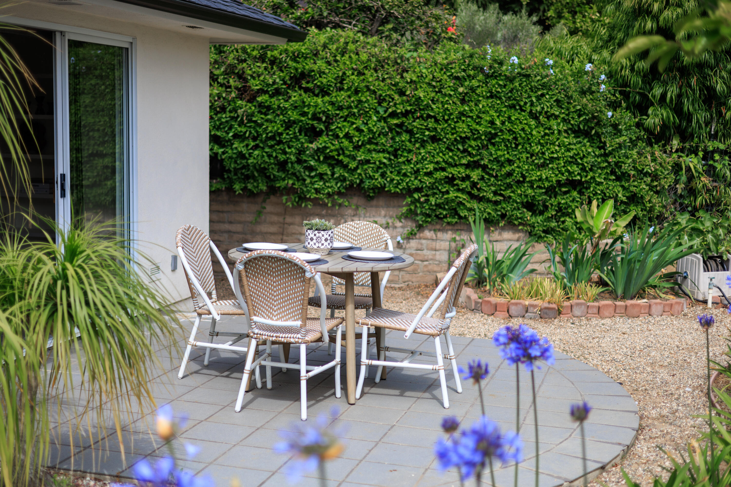 4 El Arco Drive Santa Barbara, CA 93105 - Photo 18 of 26 a patio with table and chairs and potted plants