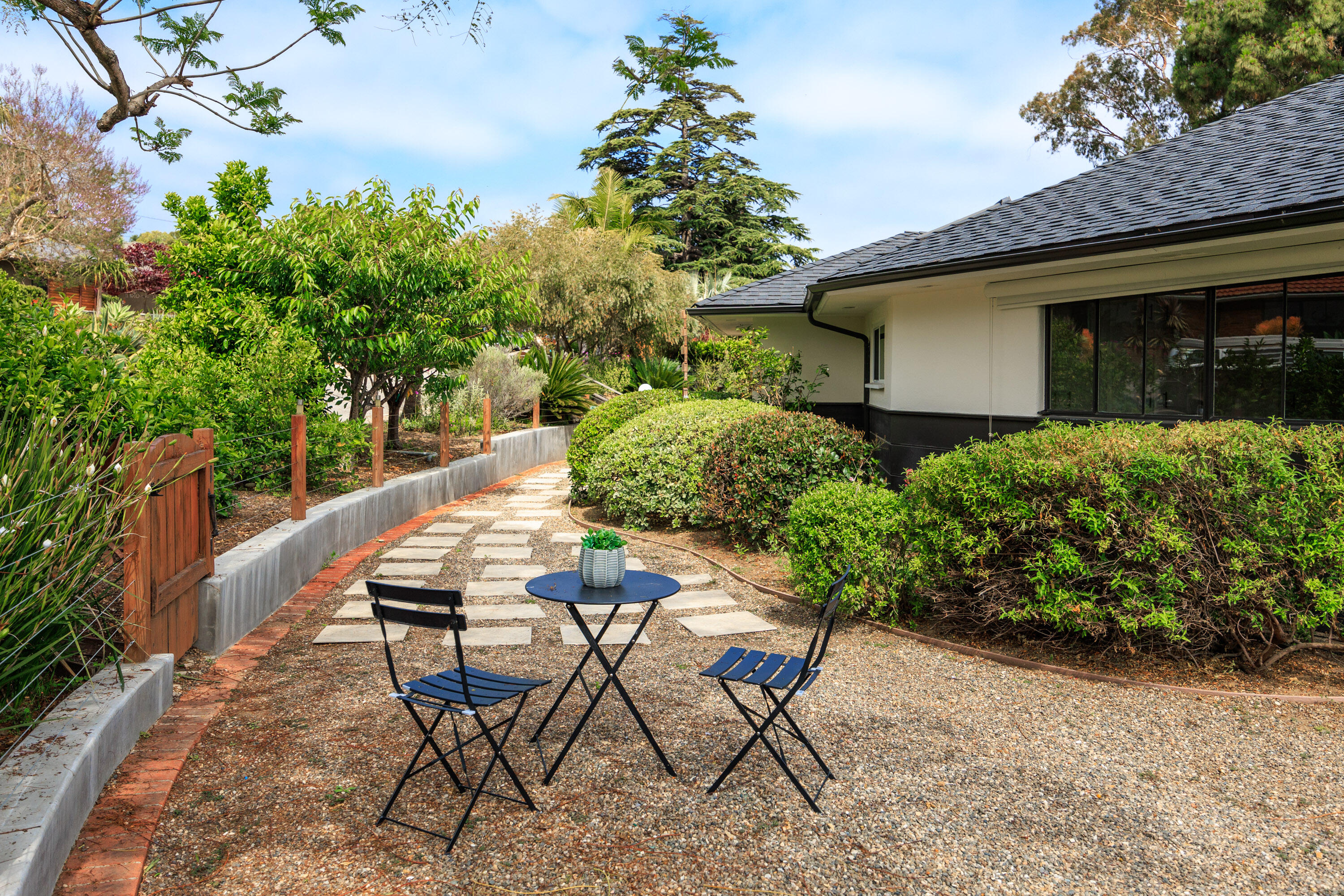 4 El Arco Drive Santa Barbara, CA 93105 - Photo 20 of 26 a view of an chairs and table in the backyard