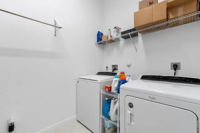 a very nice looking dining room with furniture window and outside view