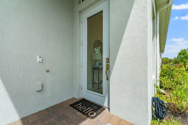 a view of hall way with furniture