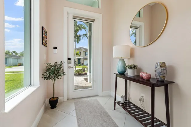 a kitchen with stainless steel appliances kitchen island granite countertop a stove a sink a microwave and a refrigerator