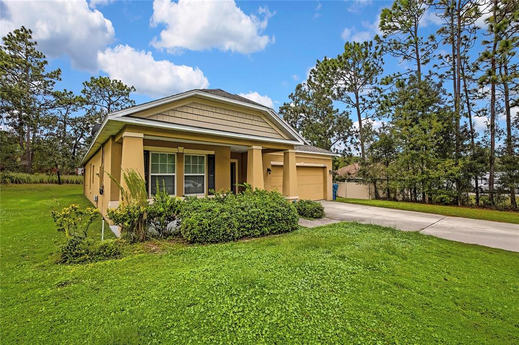 16197 Medrick Road Weeki Wachee, FL 34614 - Photo 1 of 22 a front view of house with yard and green space