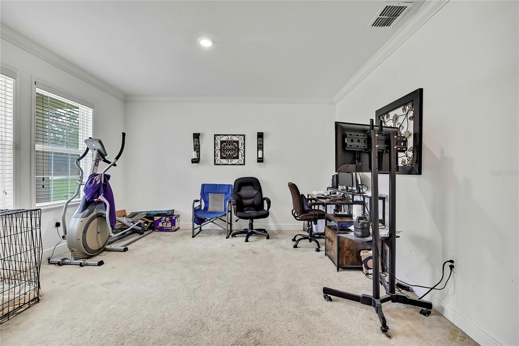 16197 Medrick Road Weeki Wachee, FL 34614 - Photo 13 of 22 a view of a room with gym equipment