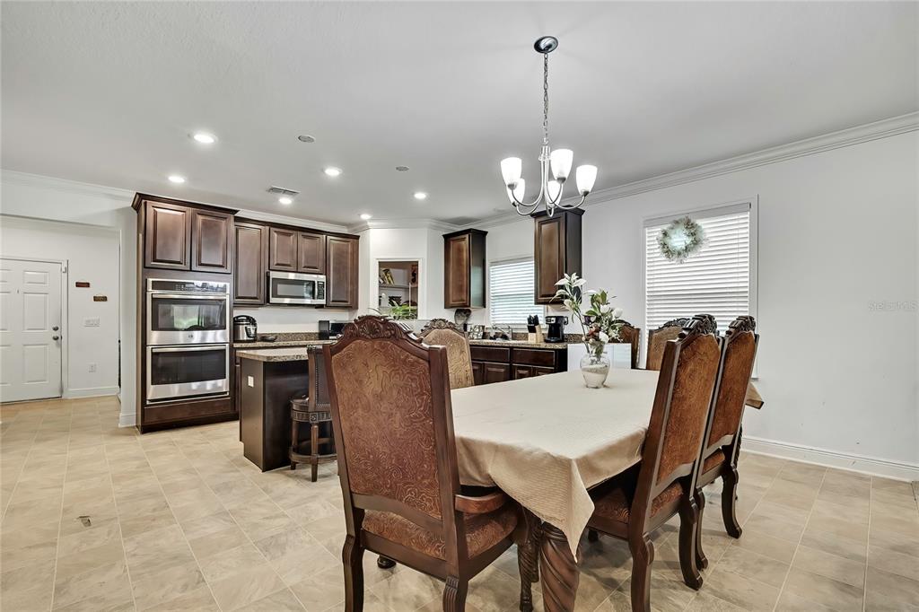 16197 Medrick Road Weeki Wachee, FL 34614 - Photo 5 of 22 a view of a dining room with furniture
