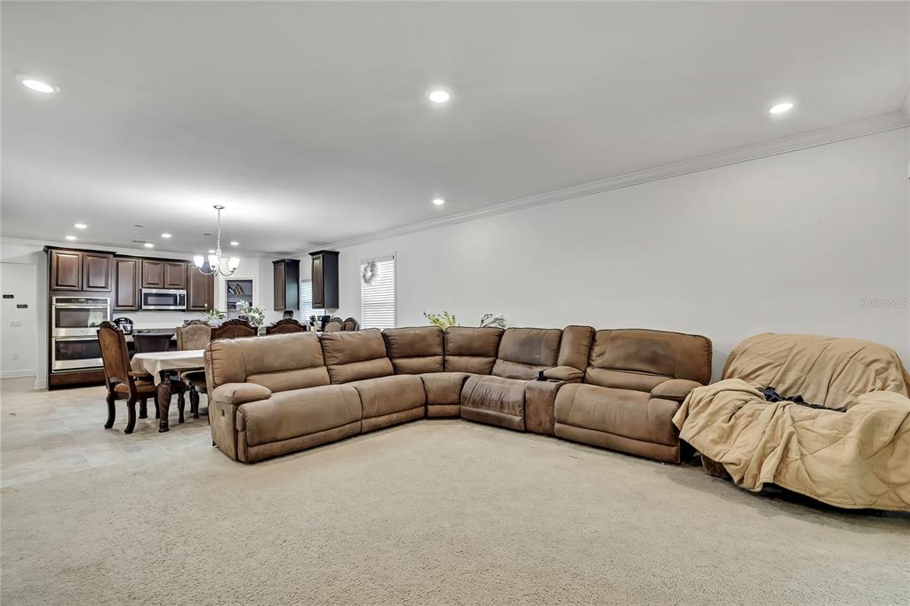 16197 Medrick Road Weeki Wachee, FL 34614 - Photo 7 of 22 a living room with furniture and a couch