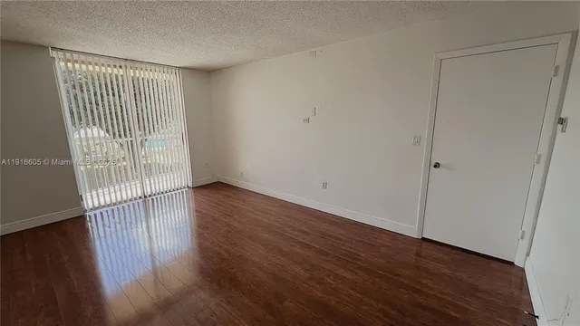 a bathroom with a light fixture and a shower