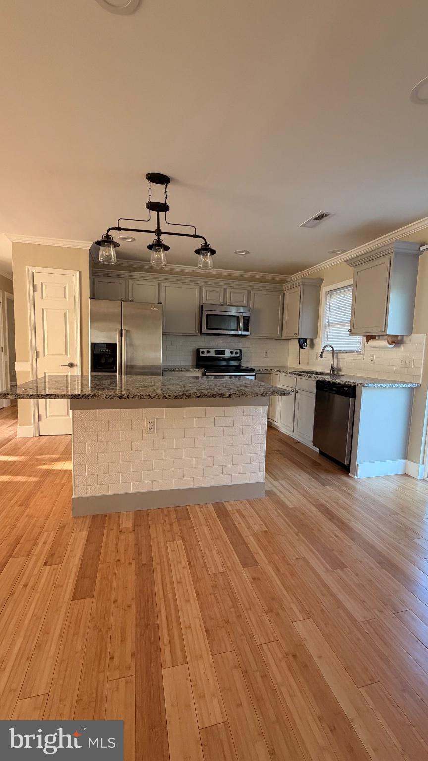 1110 High Street Cambridge, MD 21613 - Photo 18 of 22 Modern kitchen with bamboo flooring.