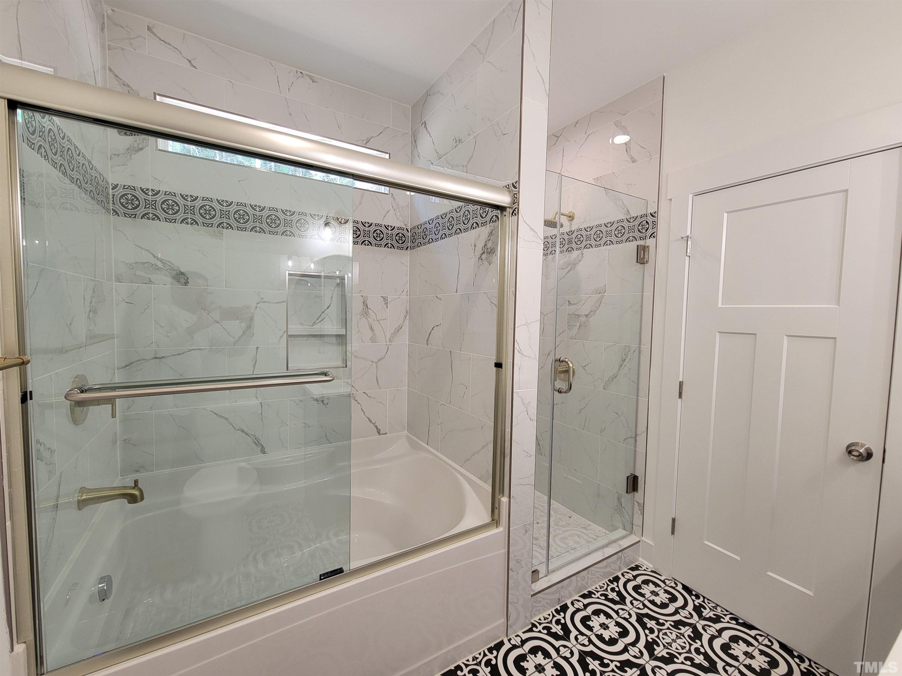 104 Glasgow Street Stem, NC 27581 - Photo 19 of 21 a bathroom with a glass shower door