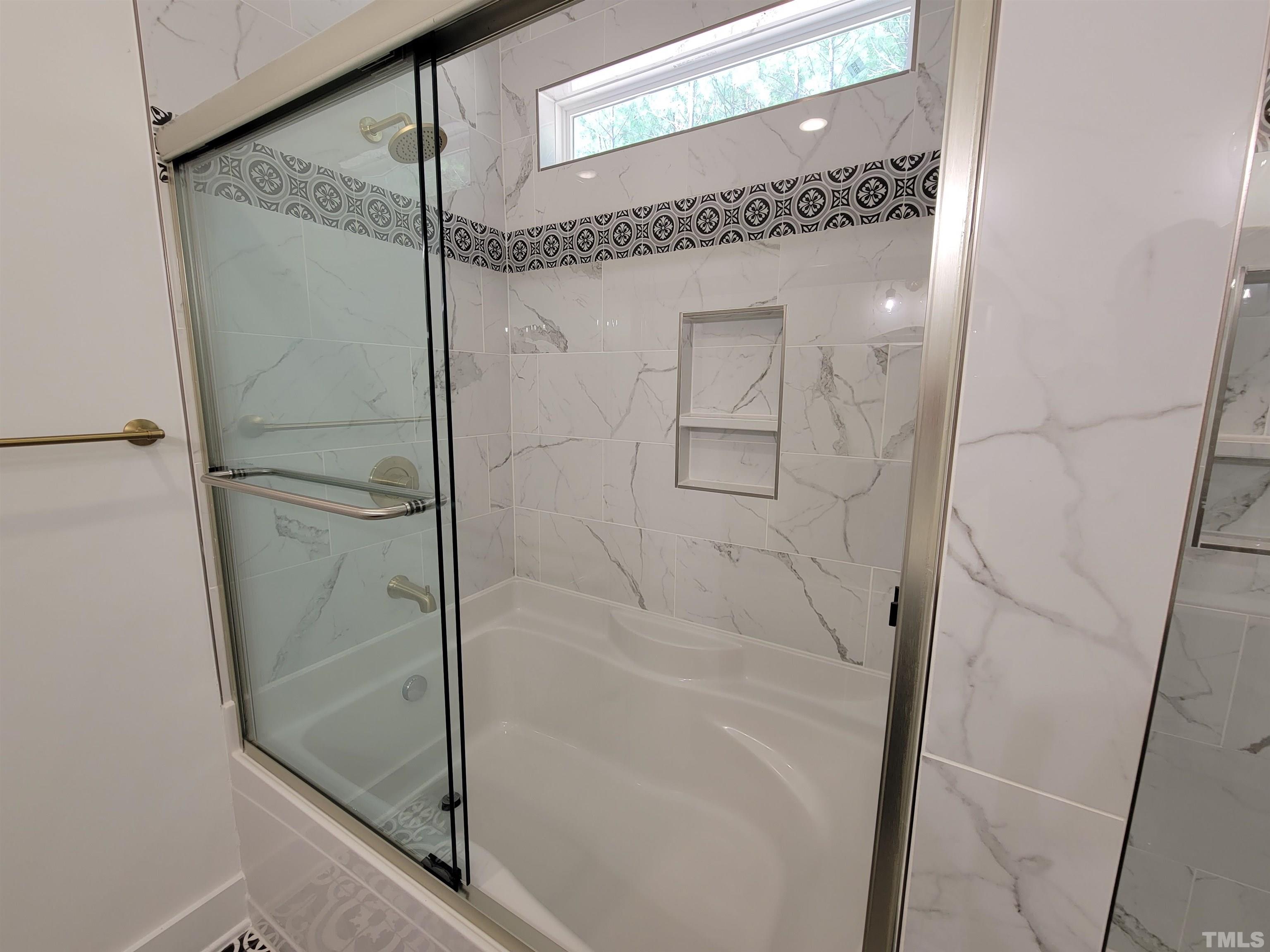 104 Glasgow Street Stem, NC 27581 - Photo 3 of 21 a bathroom with a glass shower door