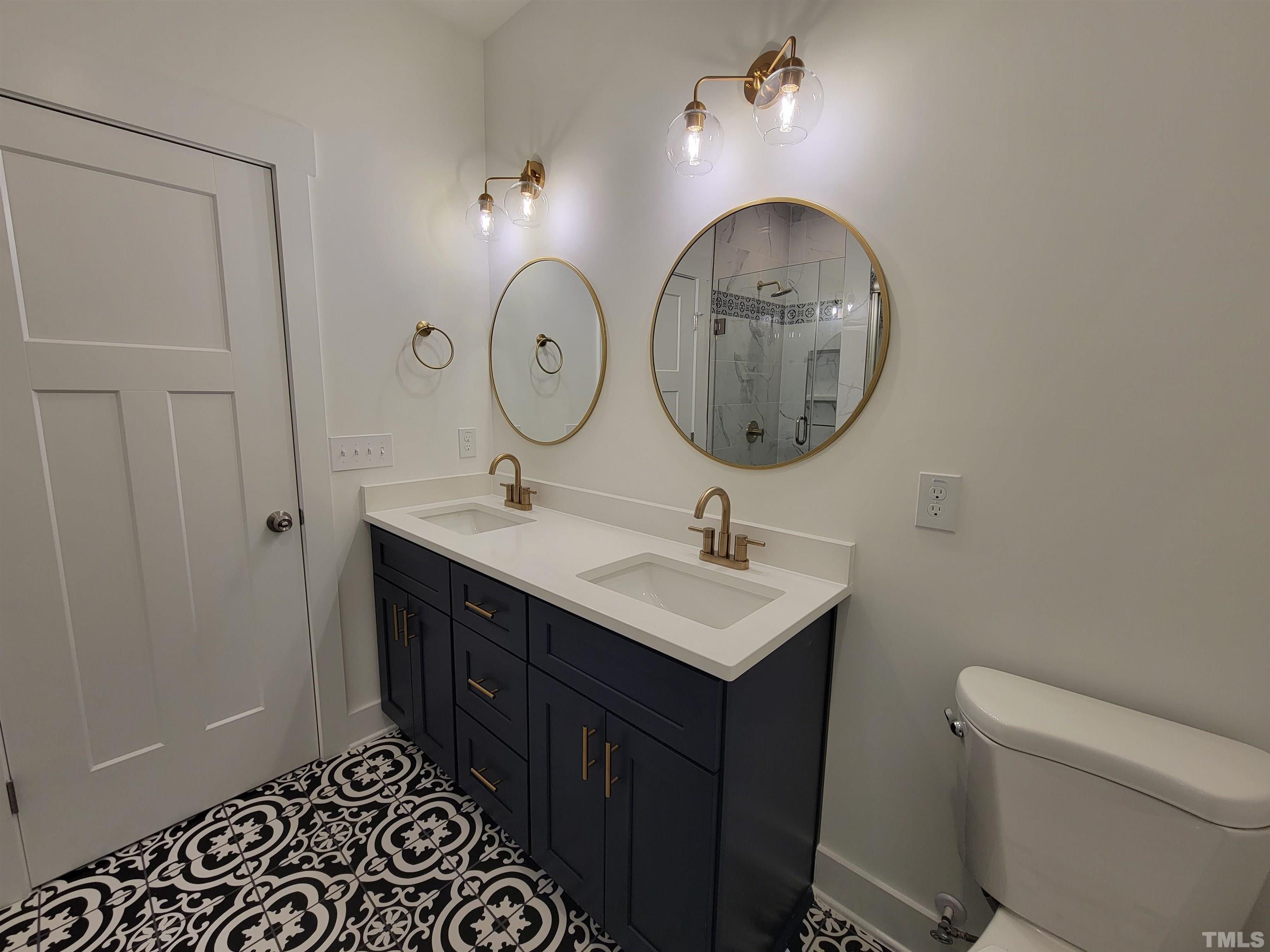 104 Glasgow Street Stem, NC 27581 - Photo 4 of 21 a bathroom with a sink and a mirror
