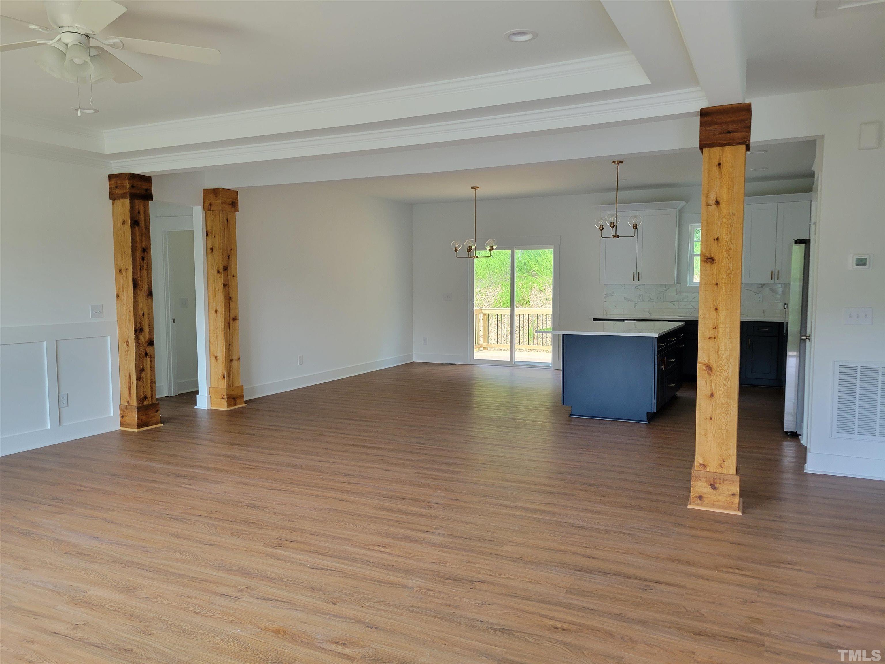 104 Glasgow Street Stem, NC 27581 - Photo 6 of 21 a view of empty room with wooden floor and window