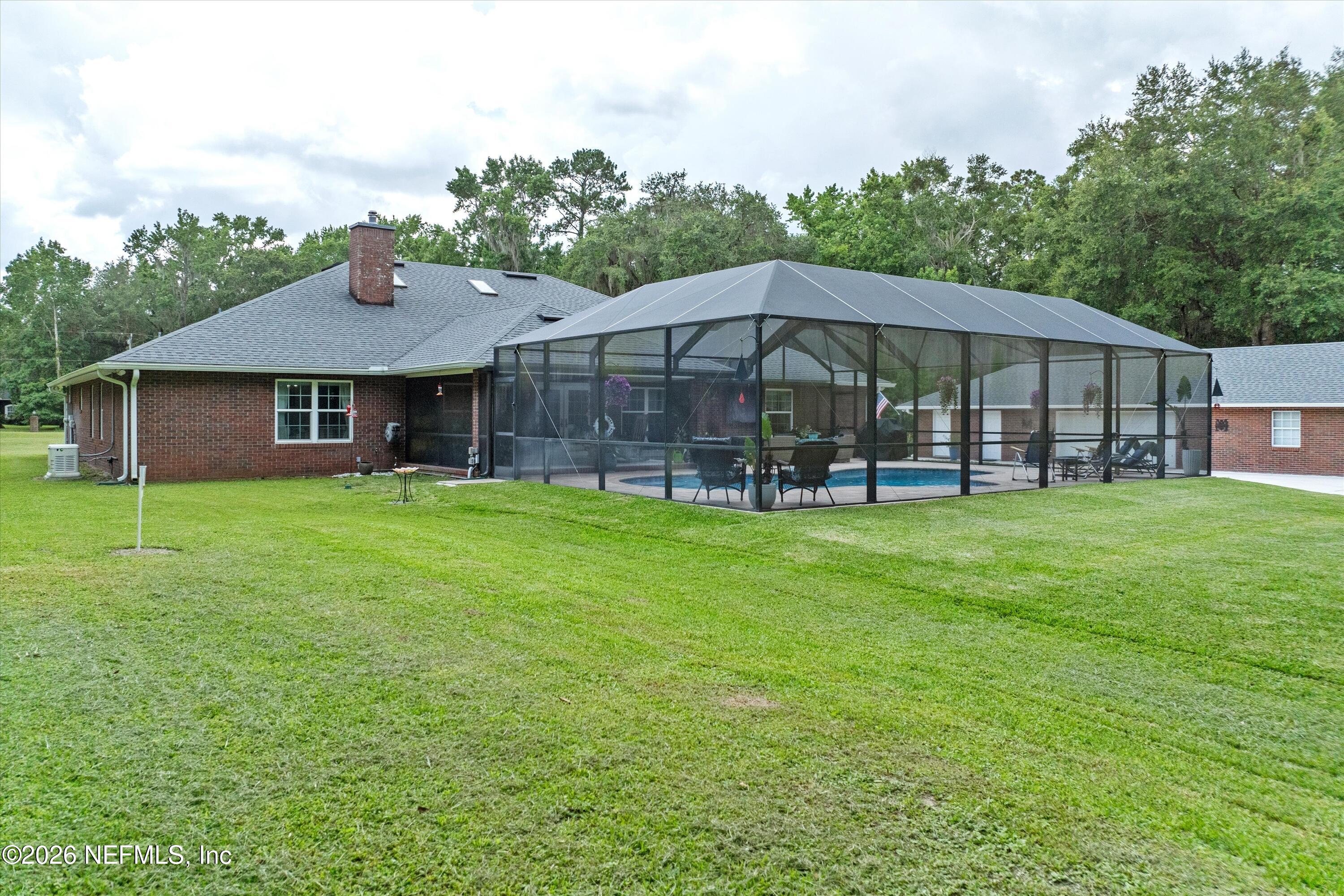 5566 Don Manuel Road Elkton, FL 32033 - Photo 44 of 47 a view of a house with a yard