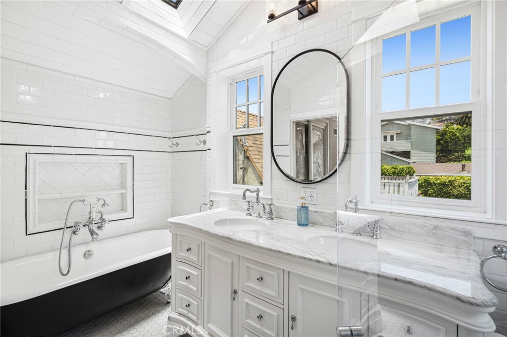 615 Seaview Street Laguna Beach, CA 92651 - Photo 19 of 33 With an ensuite bath featuring vintage-inspired tilework, a soaking tub, and marble countertops.