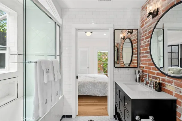 a bedroom with a large bed and a window