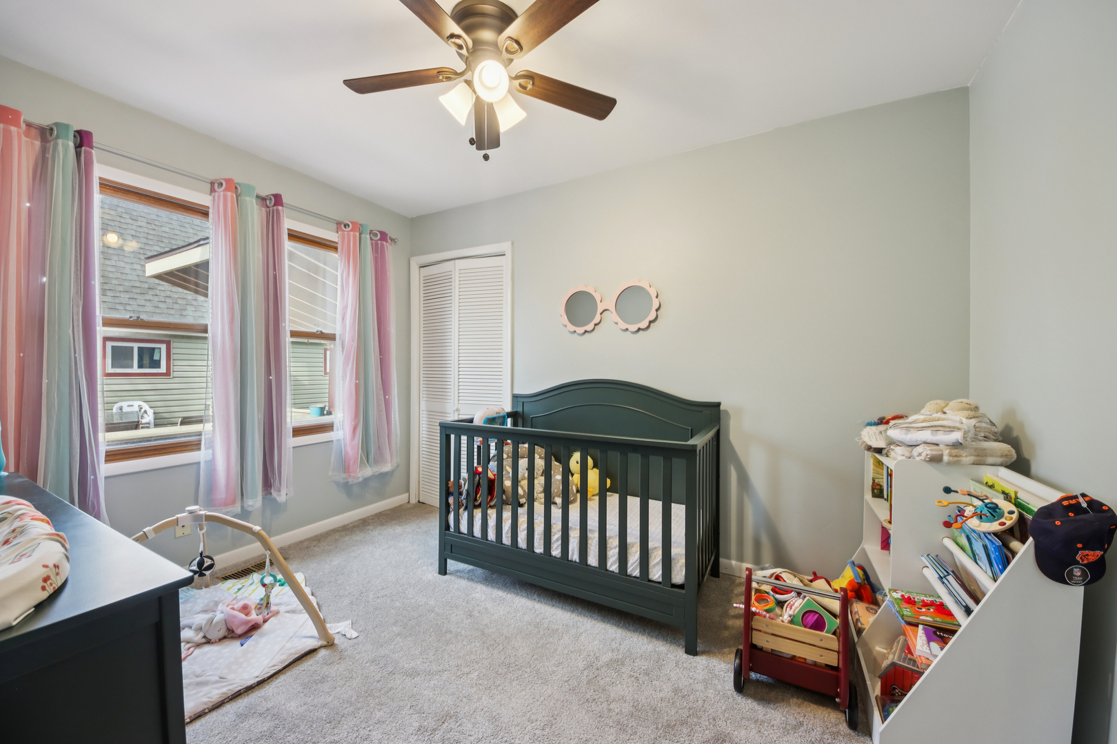 27884 West Riverside Drive Antioch, IL 60002 - Photo 11 of 45 a bedroom with a baby crib a bedroom with a bed and a chandelier