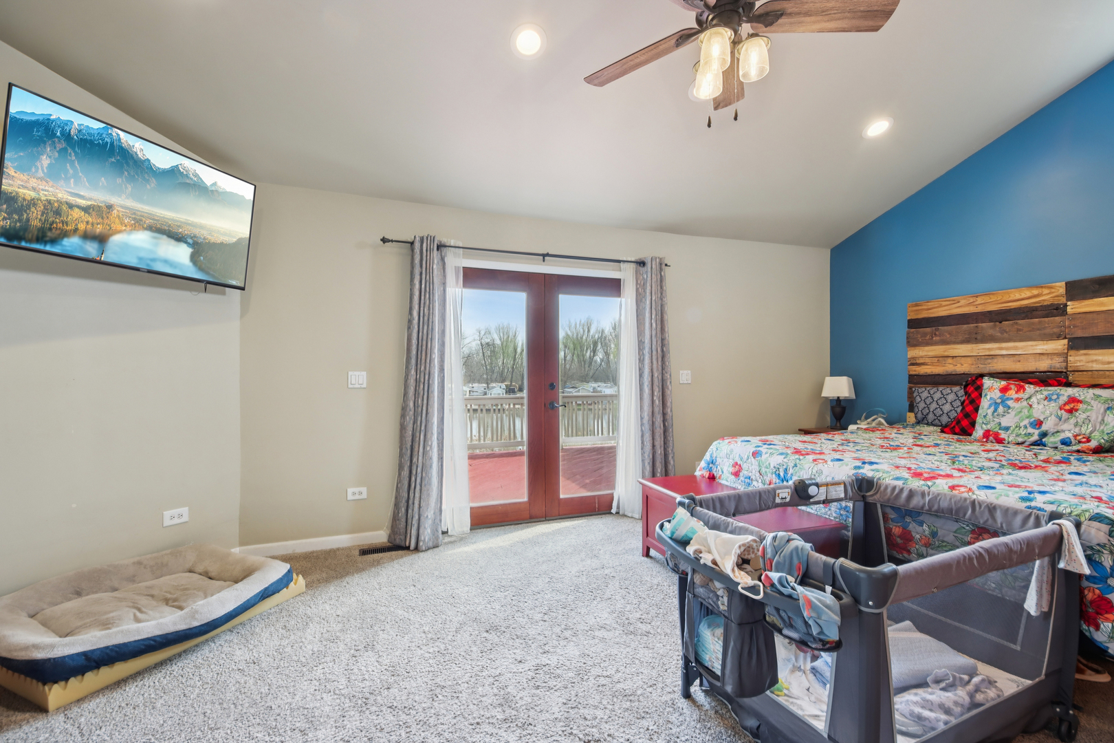 27884 West Riverside Drive Antioch, IL 60002 - Photo 14 of 45 a bedroom with a bed and a chandelier