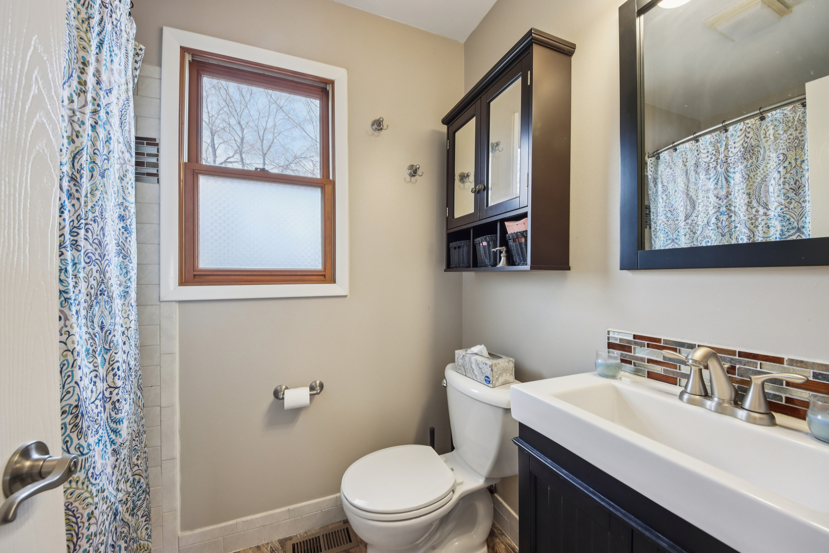 27884 West Riverside Drive Antioch, IL 60002 - Photo 21 of 45 a bathroom with a sink a toilet and a mirror