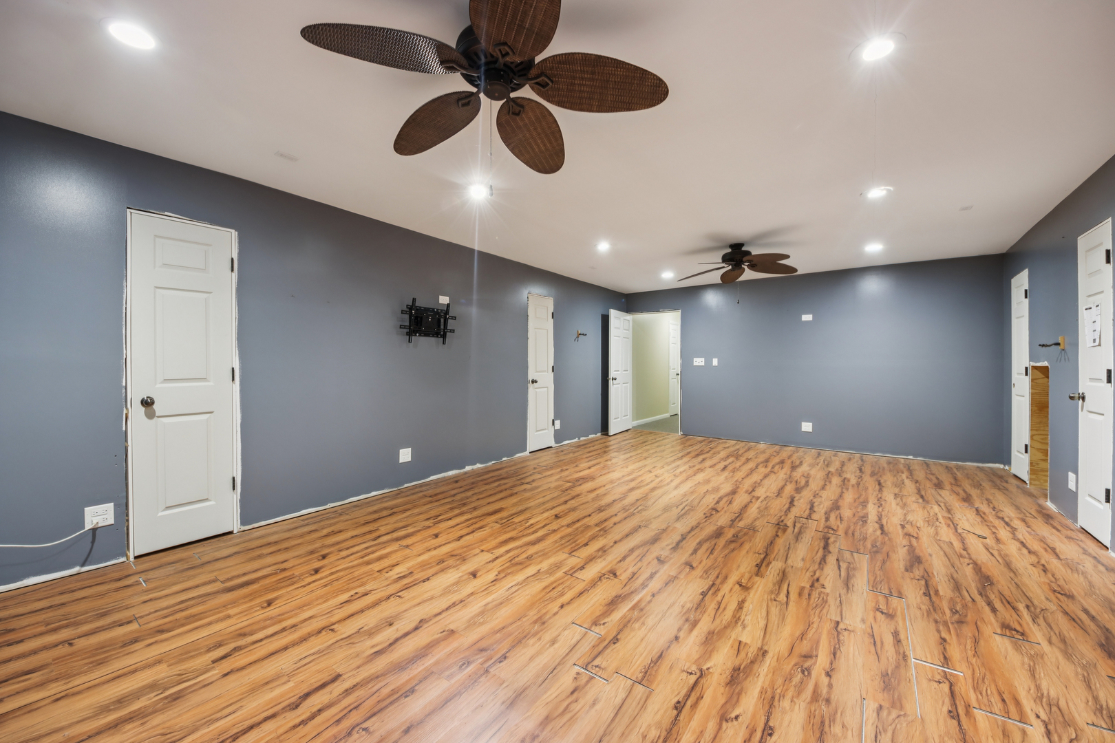 27884 West Riverside Drive Antioch, IL 60002 - Photo 22 of 45 an empty room with wooden floor and windows