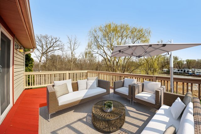 27884 West Riverside Drive Antioch, IL 60002 - Photo 45 of 45 a balcony with wooden floor and outdoor seating