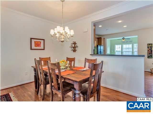 731 Rainier Road Charlottesville, VA 22903 - Photo 21 of 25 a view of a dining room with furniture and chandelier