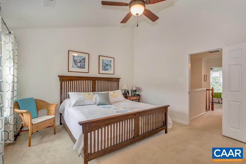 731 Rainier Road Charlottesville, VA 22903 - Photo 6 of 25 a bedroom with a bed and a chandelier