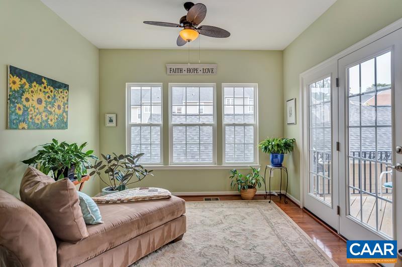731 Rainier Road Charlottesville, VA 22903 - Photo 8 of 25 a living room with furniture and a large window