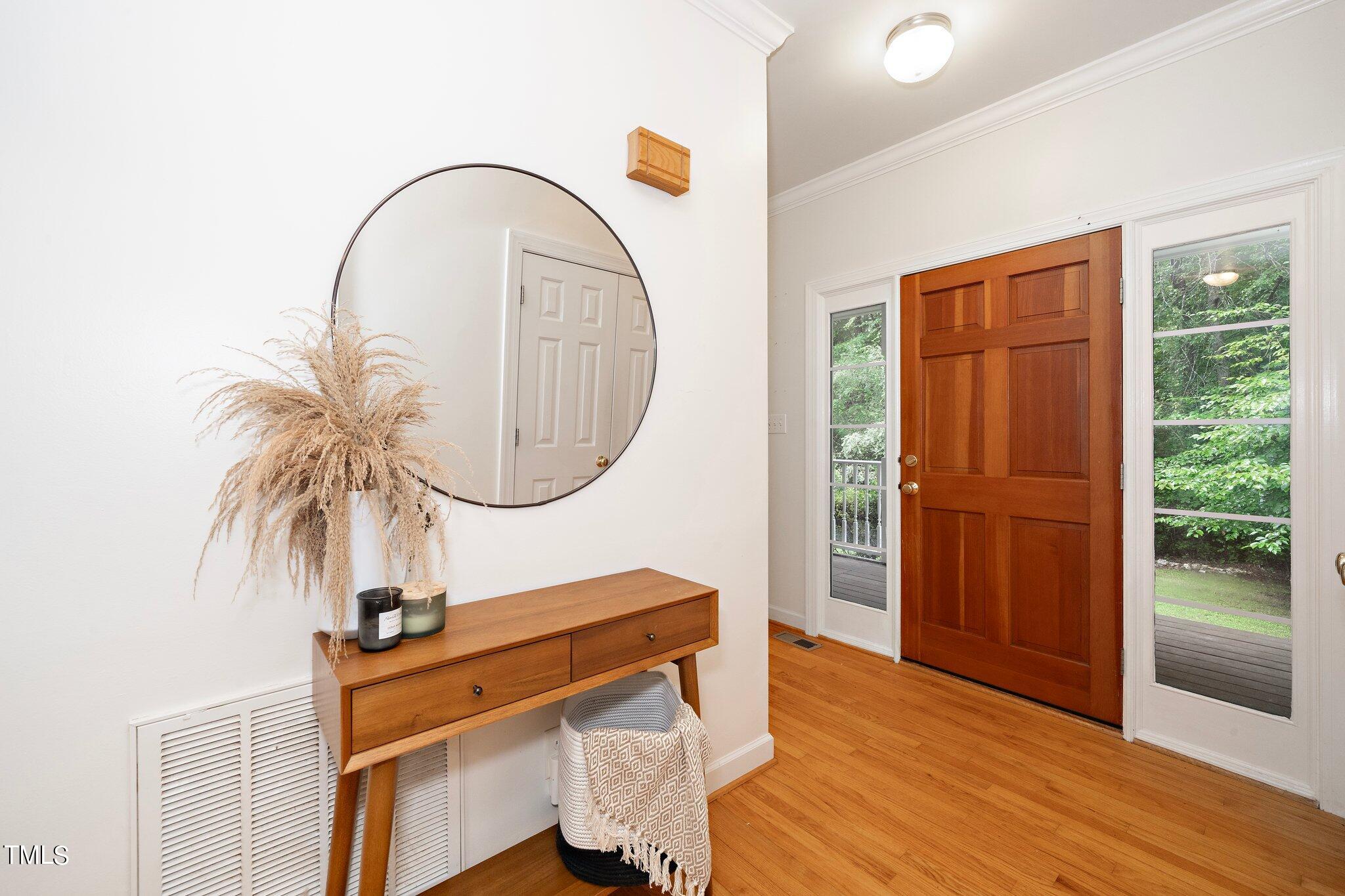 4427 Spring Meadows Road Hillsborough, NC 27278 - Photo 11 of 42 a room with wooden floor and furniture