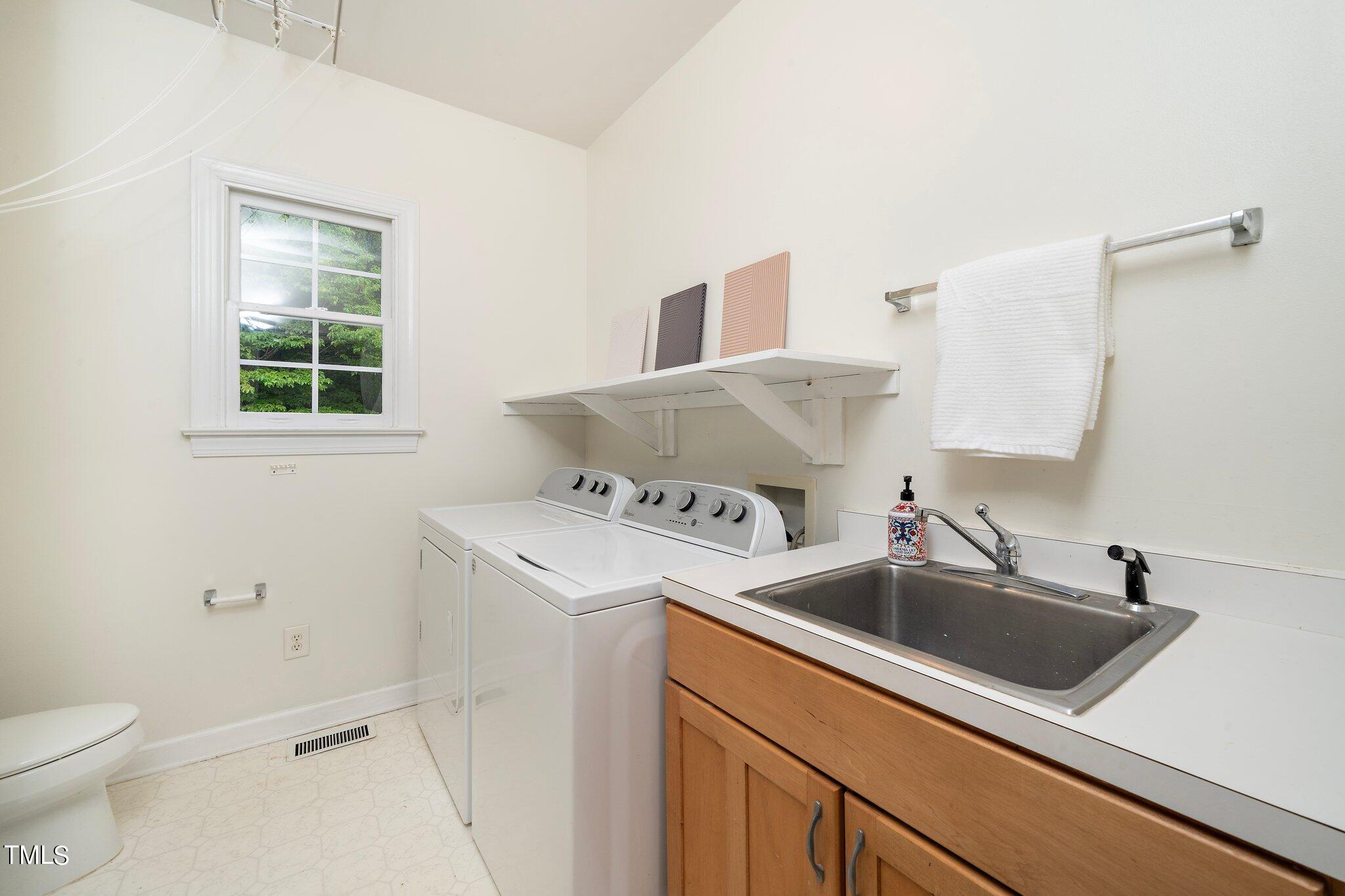 4427 Spring Meadows Road Hillsborough, NC 27278 - Photo 15 of 42 a utility room with sink dryer and washer