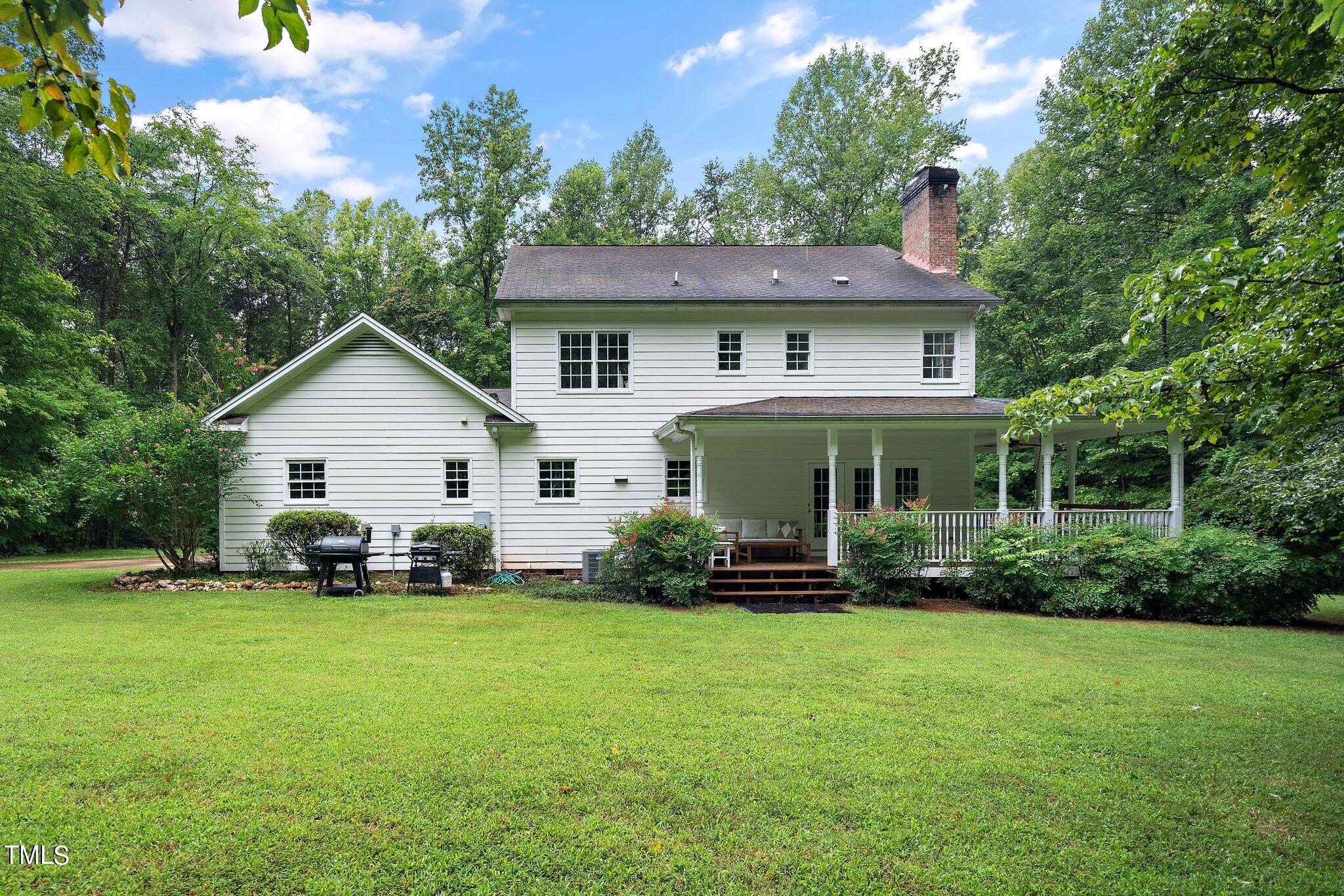 4427 Spring Meadows Road Hillsborough, NC 27278 - Photo 25 of 42 a view of a house with a yard