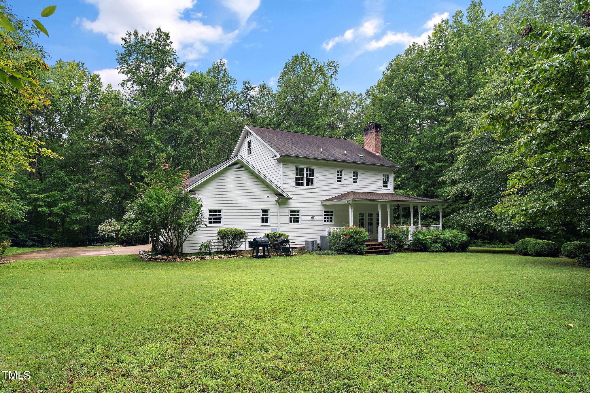 4427 Spring Meadows Road Hillsborough, NC 27278 - Photo 31 of 42 a view of a house with a yard