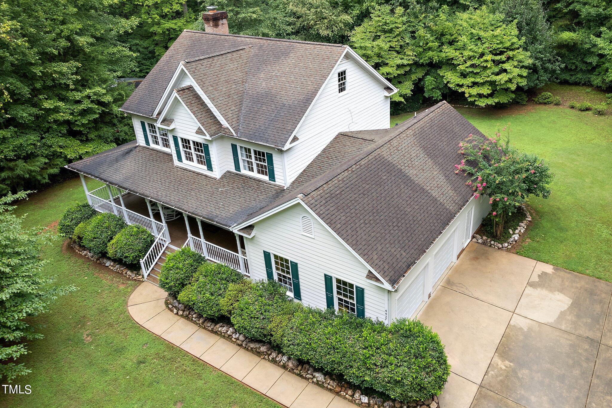 4427 Spring Meadows Road Hillsborough, NC 27278 - Photo 38 of 42 a aerial view of a house next to a yard